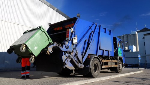 electric waste collection van parked in Kentish Town outside a small business premises