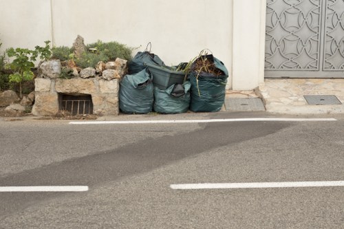 Builders clearing construction waste in Kentish Town site